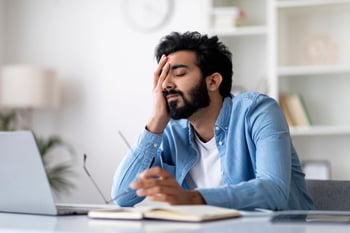 Man Stressed at Desk 2