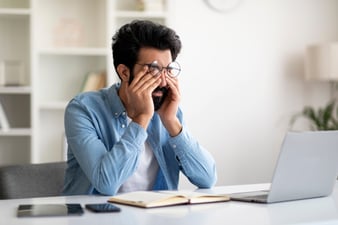 Man Stressed and Tired at Desk