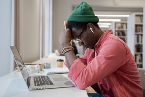 Student Stressed at Desk